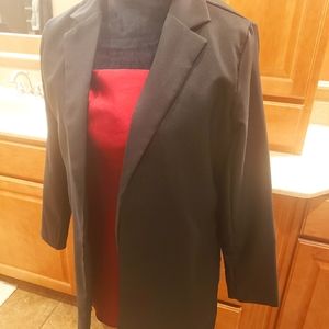 Black lined, long sleeve blazer.